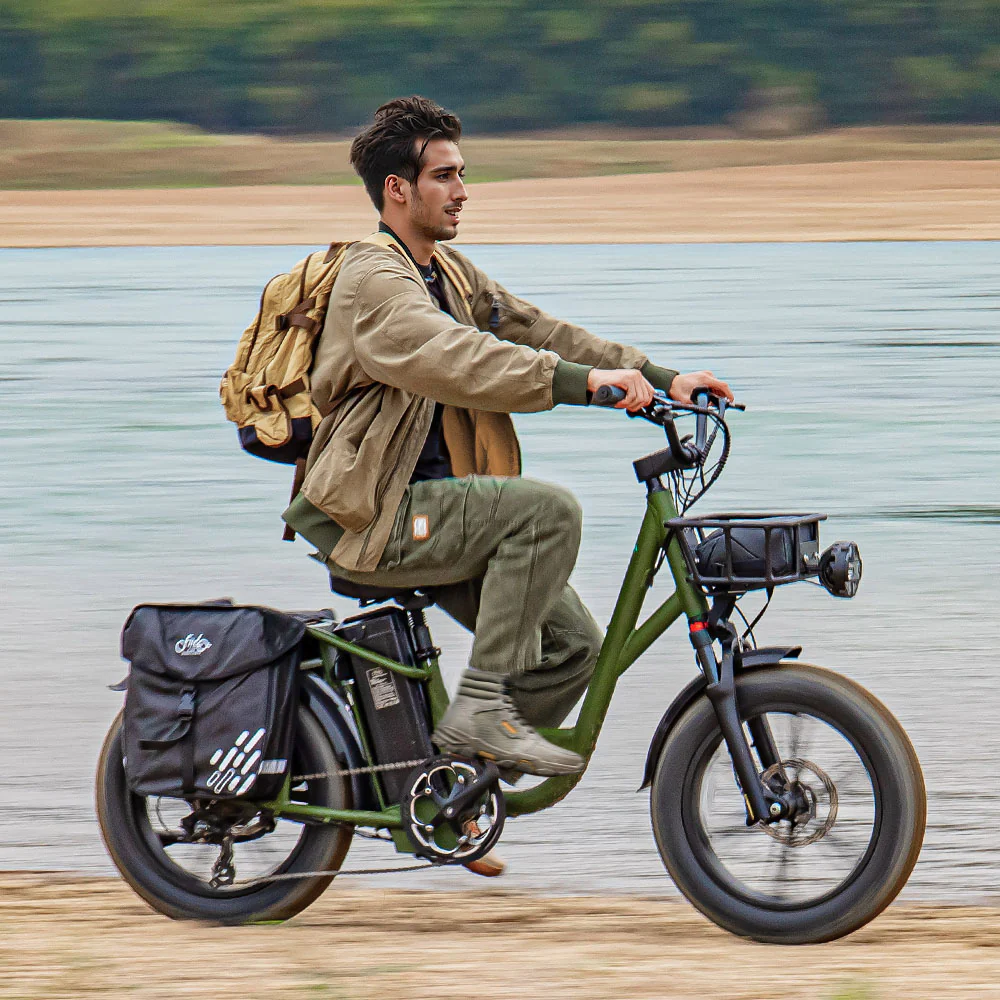 Man riding on the beach on his Fiido T1 pro